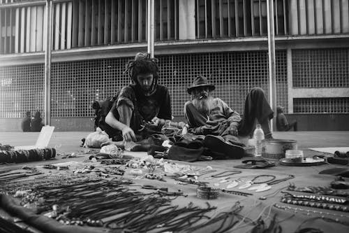 Two Men Sitting On Floor 