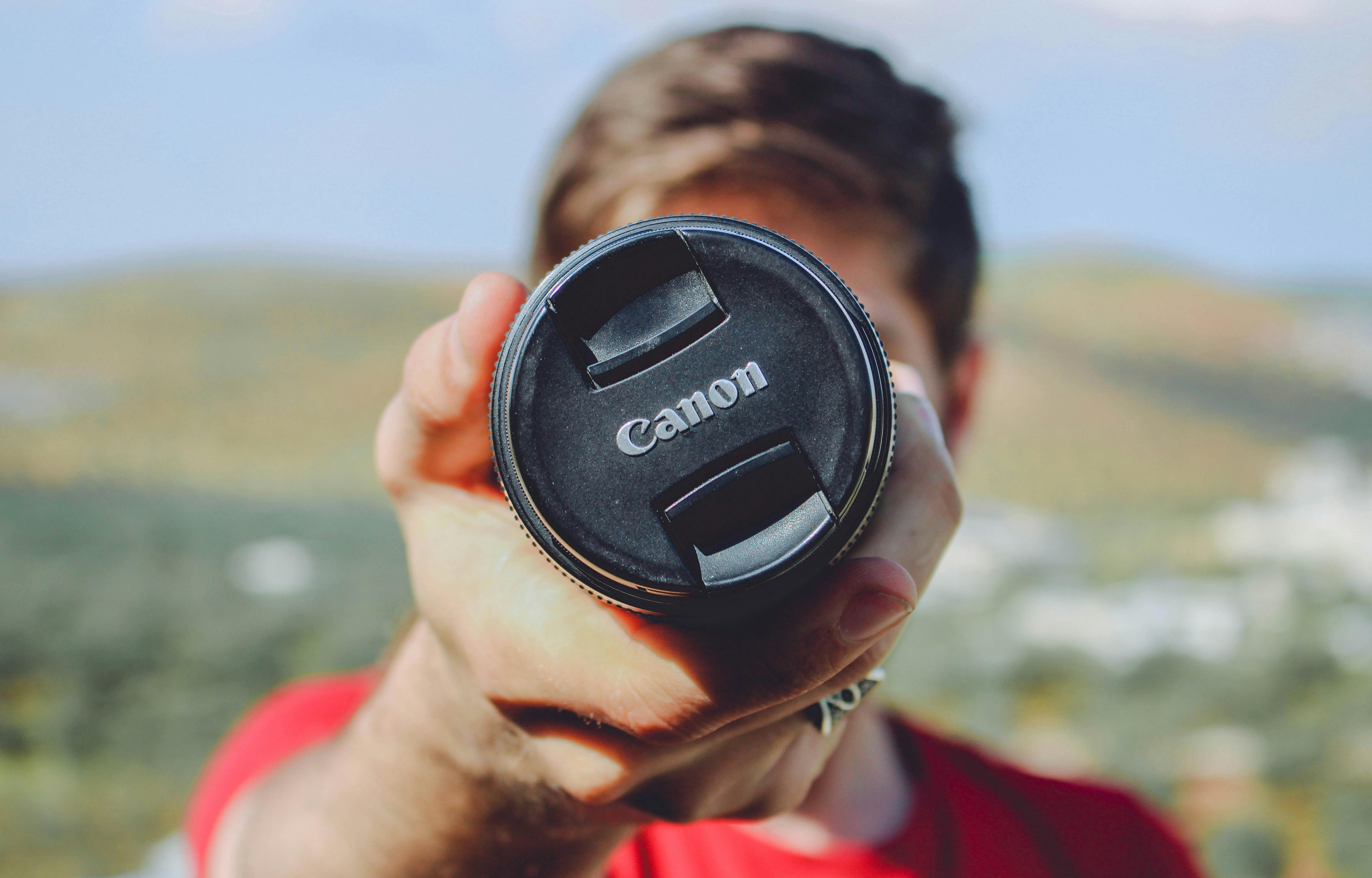 Man Holding Canon Dslr Camera · Free Stock Photo