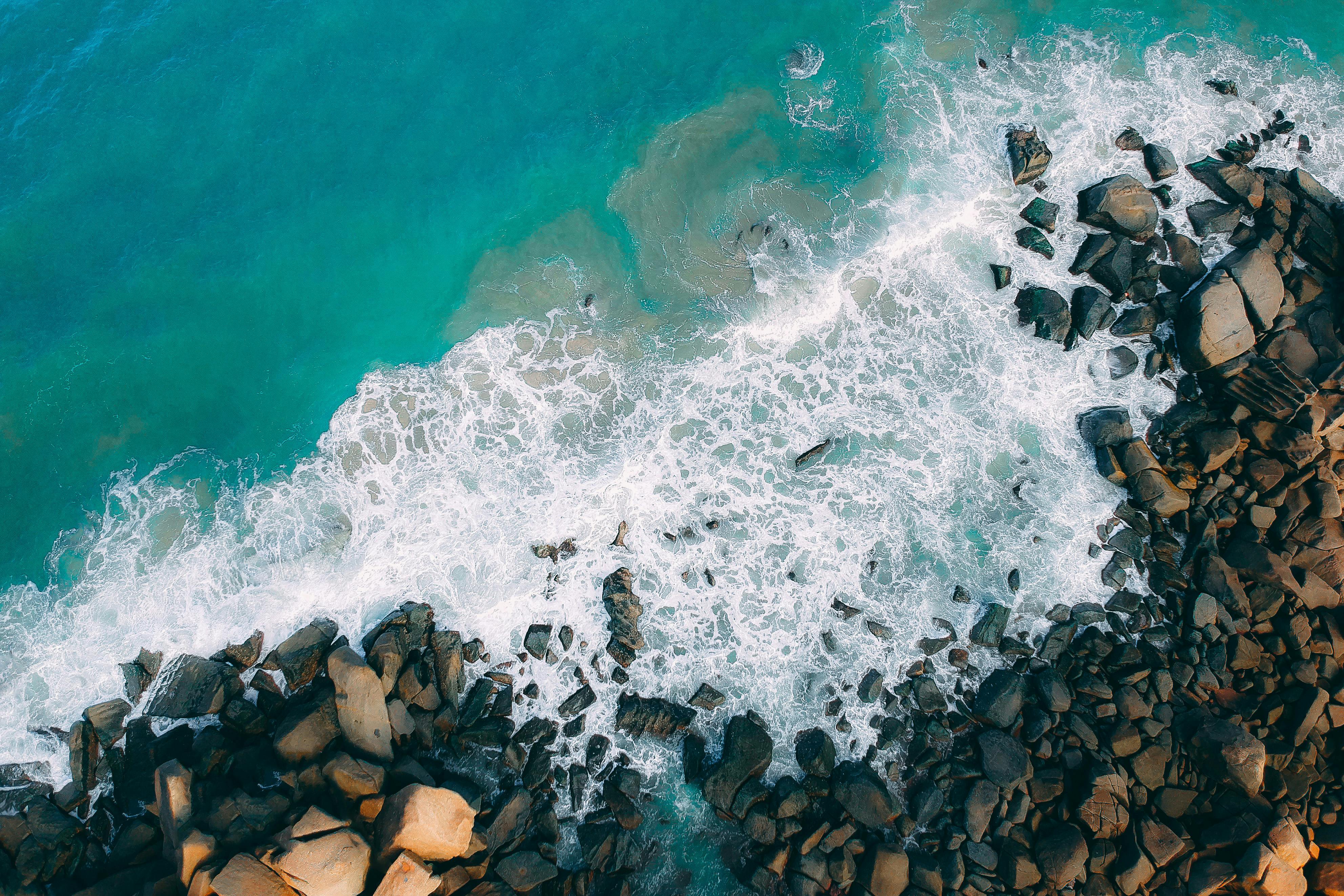 Top View Photo of Rocky Shore · Free Stock Photo