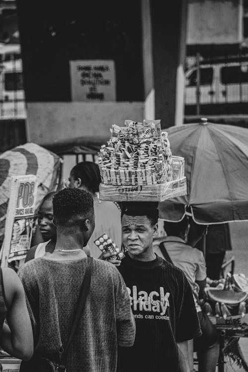 Merchant Carrying Merchandise on Head