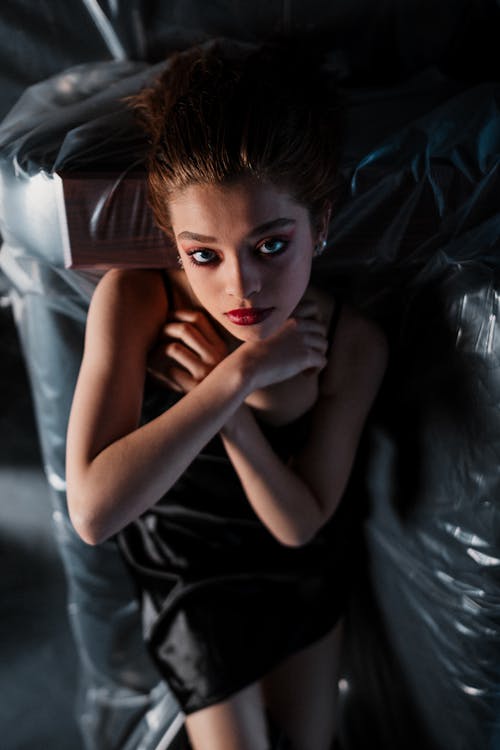 Model Posing In Front of Black Foil