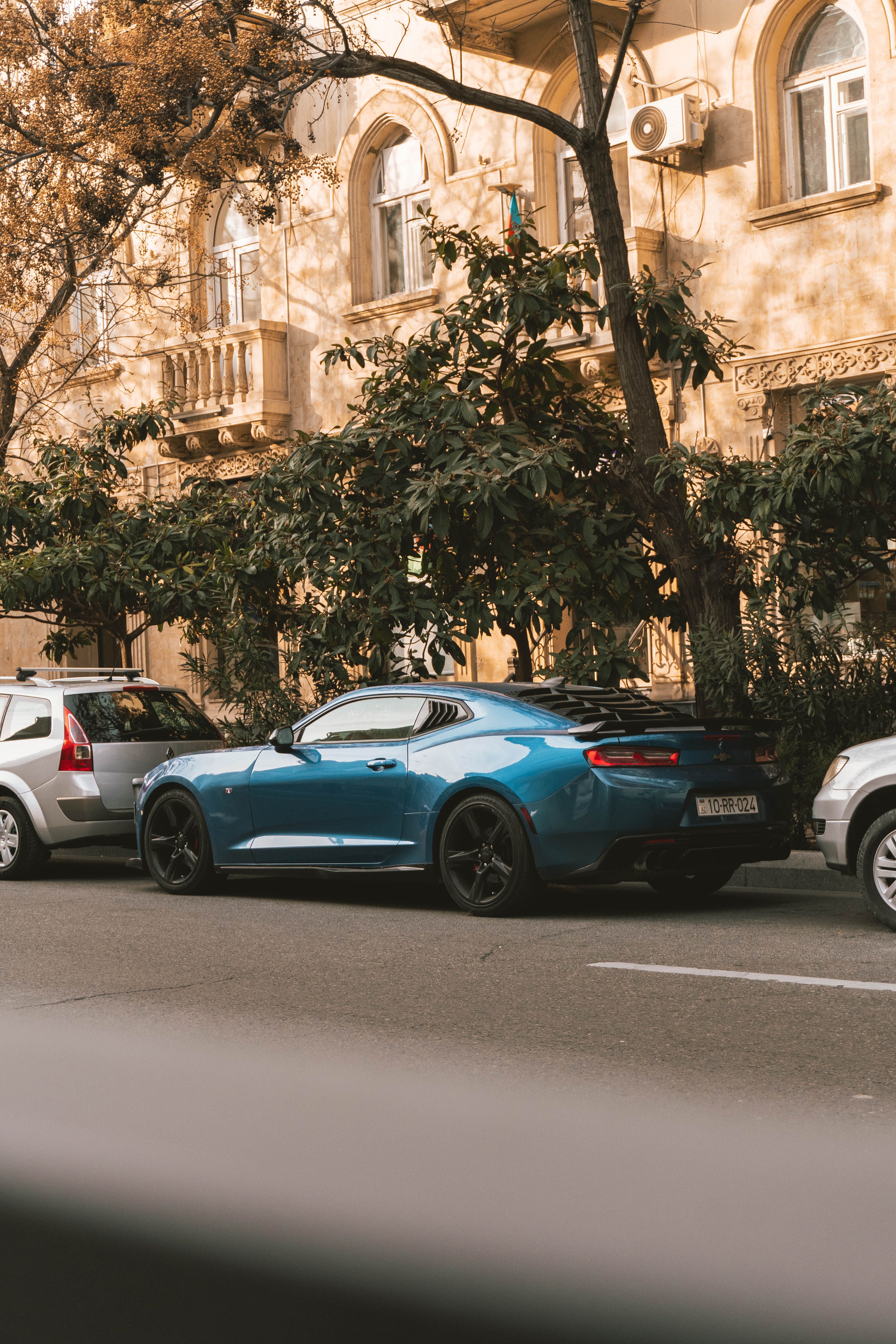 View of Cars Parked on the Side of a Street in City · Free Stock Photo