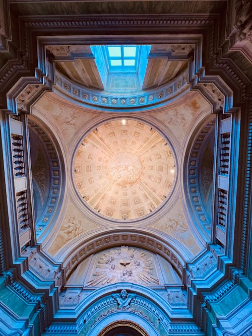 The ceiling of a building with a dome