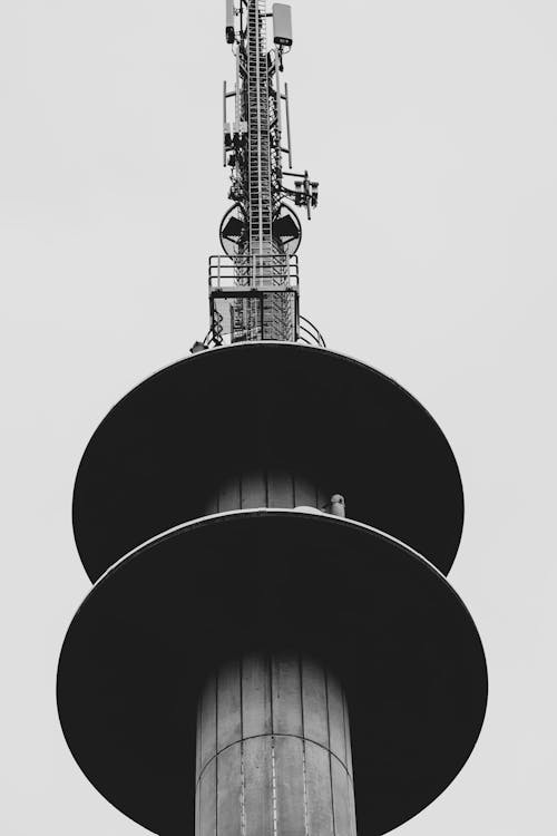 A black and white photo of a tall tower