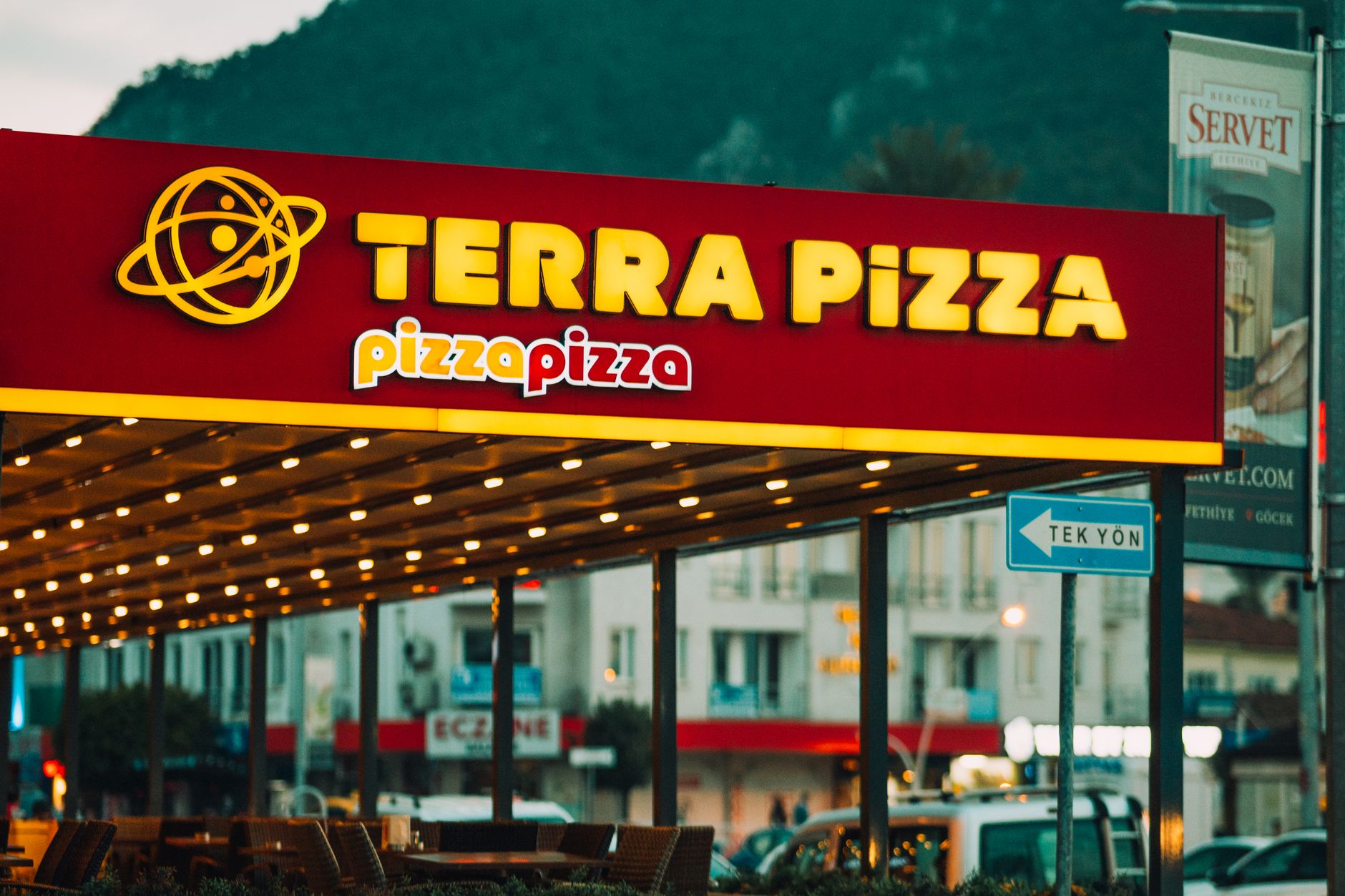 Pizza in delivery boxes from an international chain arranged for sharing