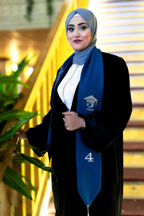 Portrait of Graduate in Gown and Hijab