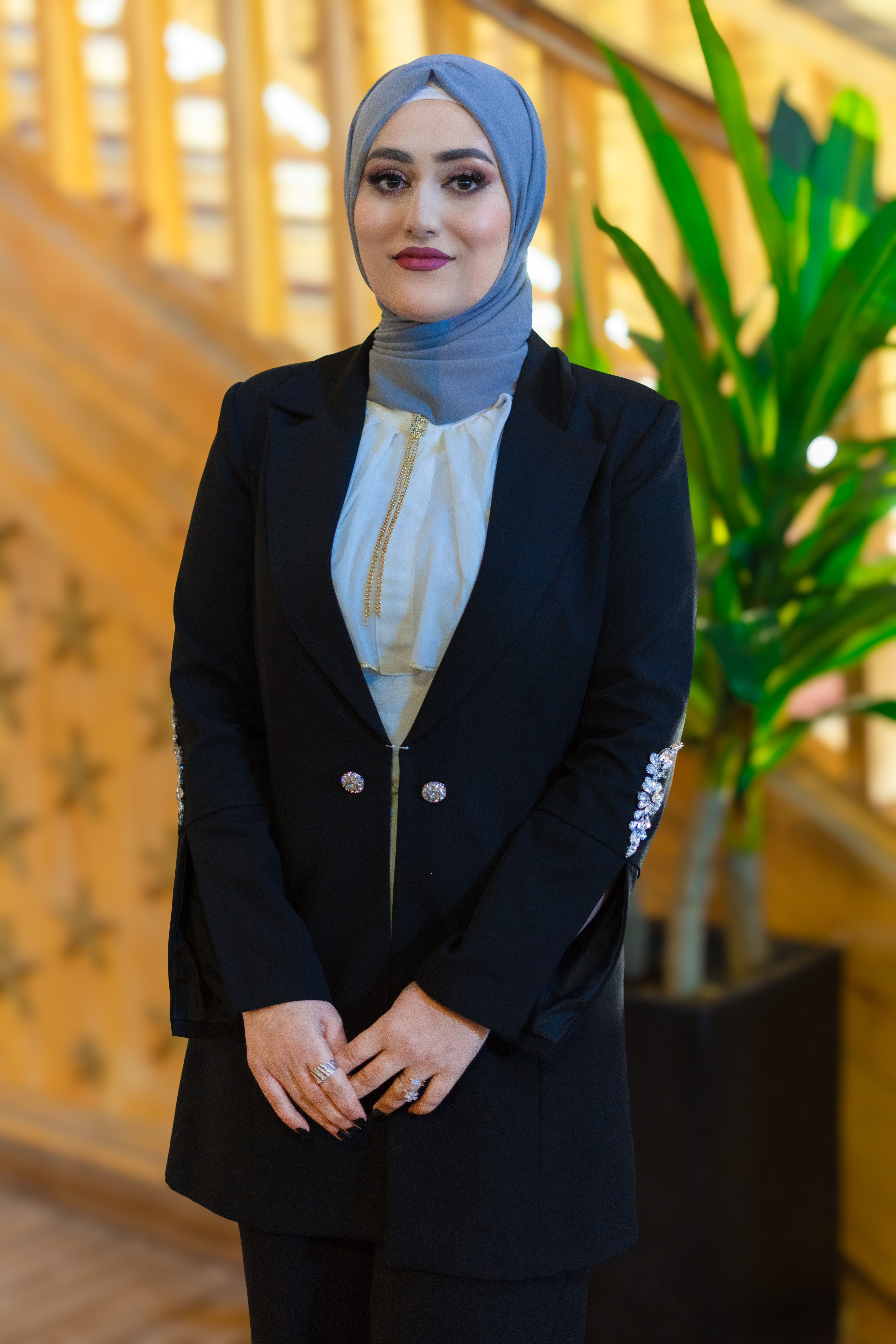 Portrait of Woman in Black Suit and Hijab