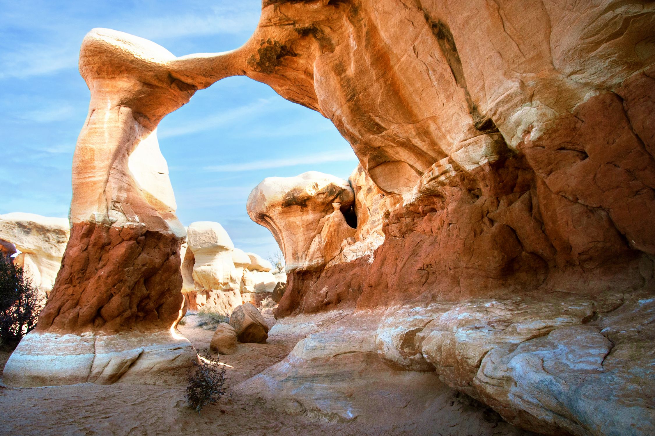 Breathtaking view of a natural rock arch in Utah's Grand Staircase-Escalante desert.