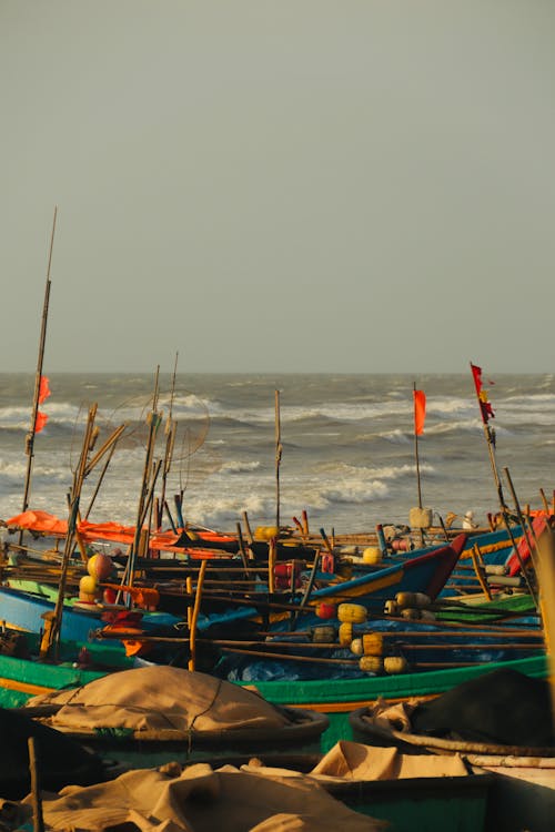 A group of boats on the beach