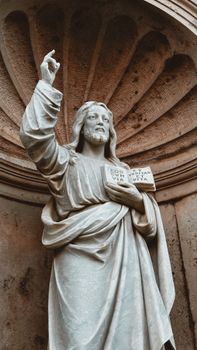 A detailed marble statue of Jesus Christ in Prčanj, Montenegro. Captured outdoors.