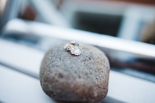 Pendant on Brown Rock Fragment during Daytime