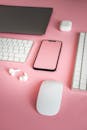 Electronic Devices on Pink Desk