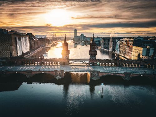 Free Stunning aerial shot of Oberbaum Bridge and River Spree at sunset in Berlin, Germany. Stock Photo
