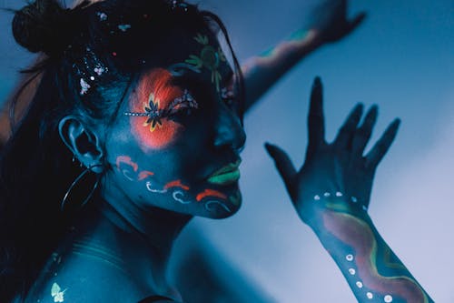 A woman with her face painted in black and white