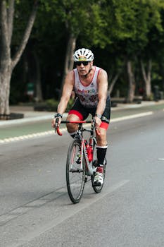 A cyclist competes in a city race wearing cycling gear, capturing motion and determination.