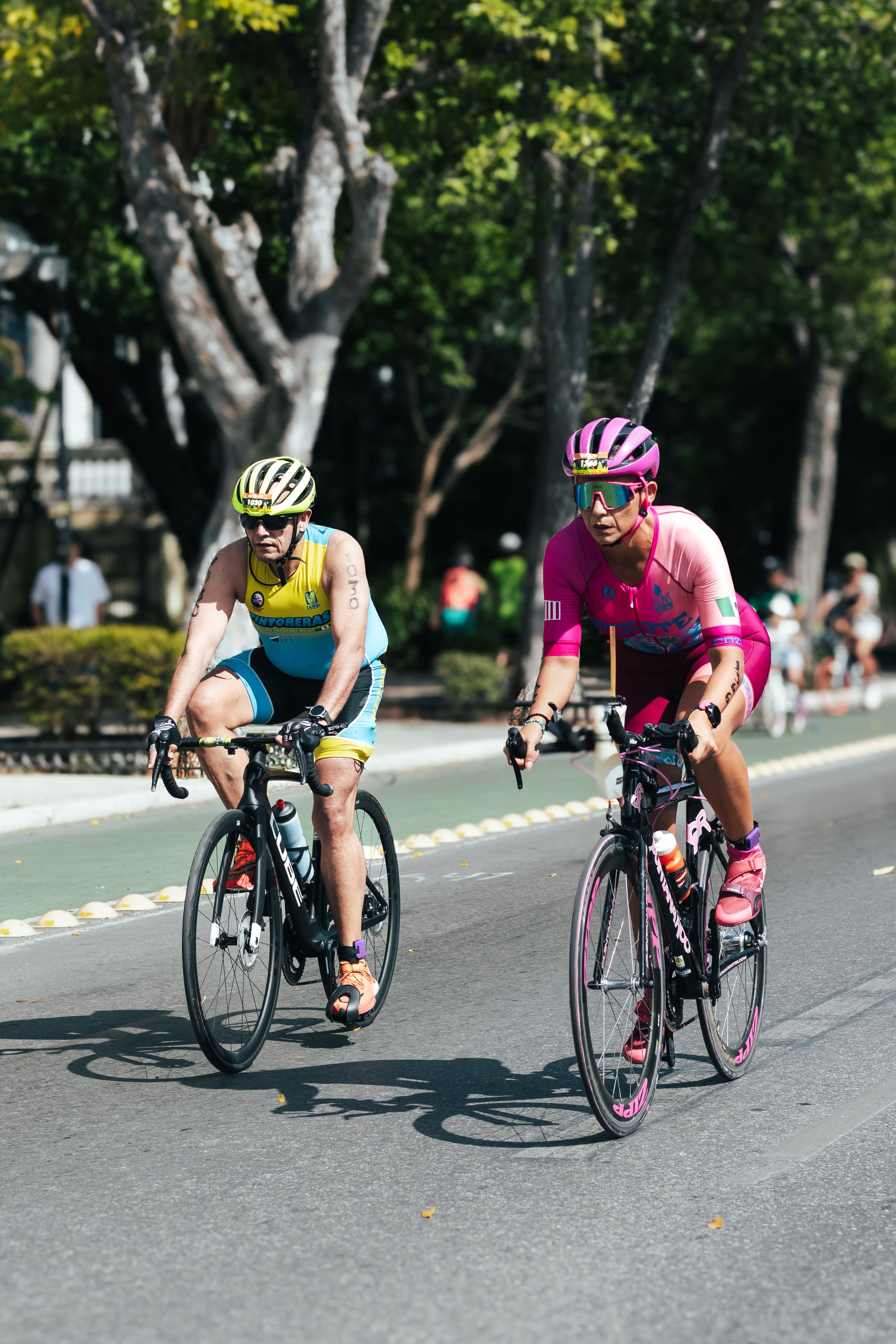 Men Riding on Bikes on a Street · Free Stock Photo