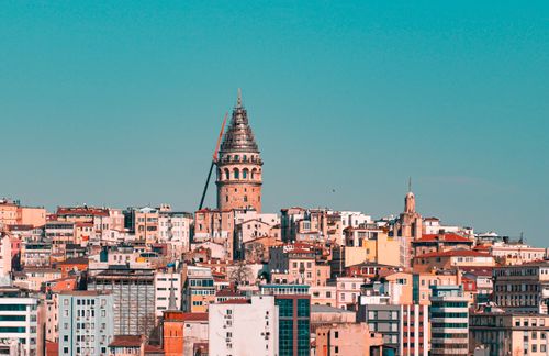 Free A stunning view of the Galata Tower amidst a dynamic Istanbul cityscape, highlighting historical architecture. Stock Photo