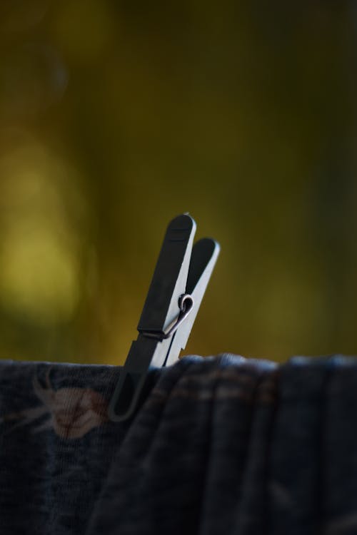 A close up of a clothes peg on a clothes line