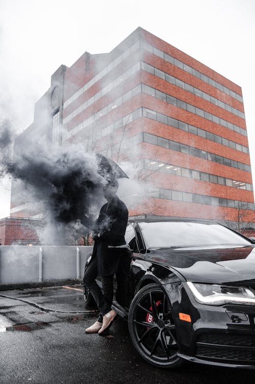 Person Standing Beside Car