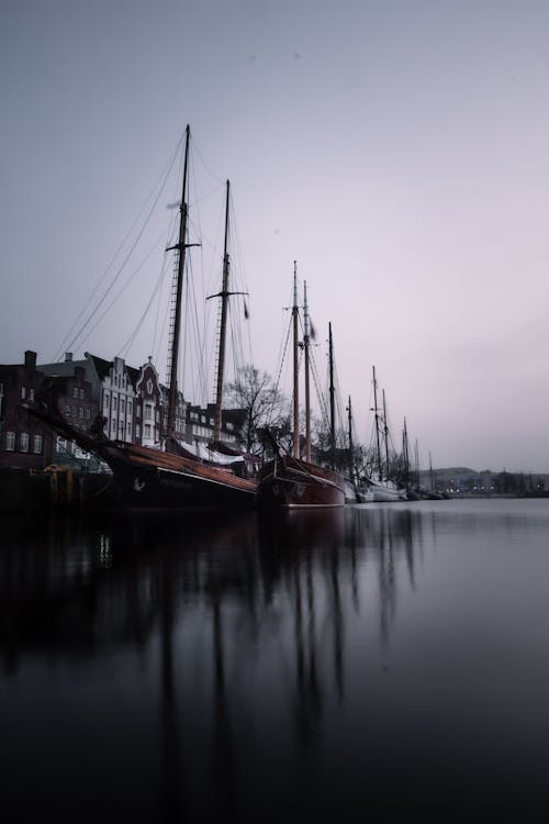 Old Vessels Moored to Waterfront in City