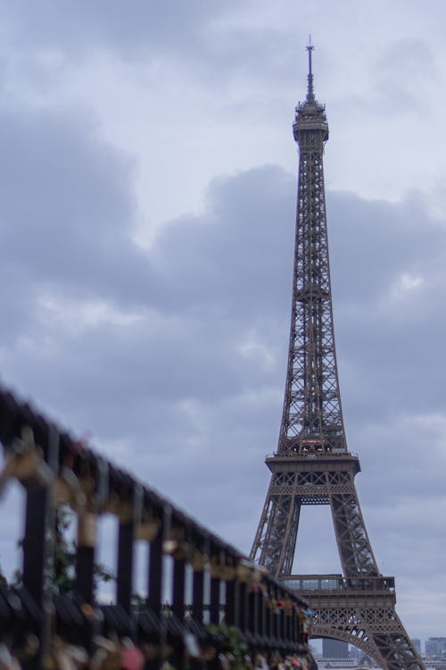 The eiffel tower is seen from a balcony