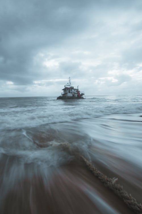 A boat is in the ocean with waves