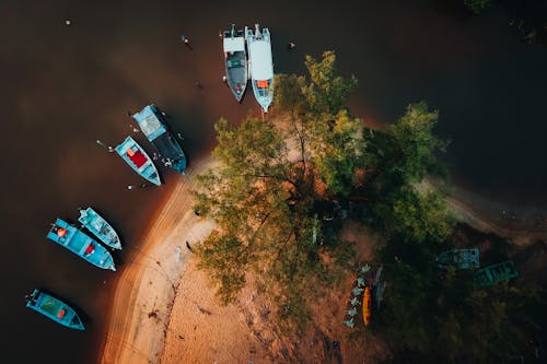Aerial View of Boats Moored on a Sandy Lakeshore