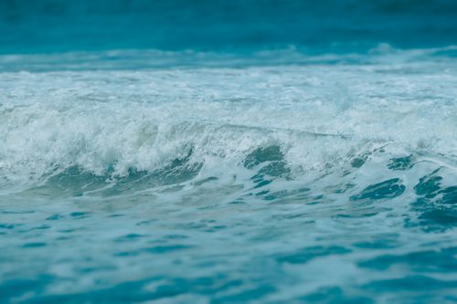 Free Dynamic close-up shot of turquoise ocean waves capturing the essence of the sea. Stock Photo
