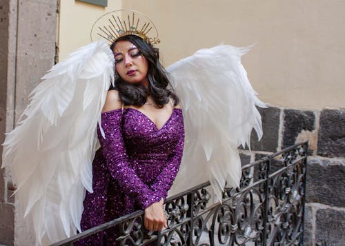 Woman in Purple Dress and with Angel Wings