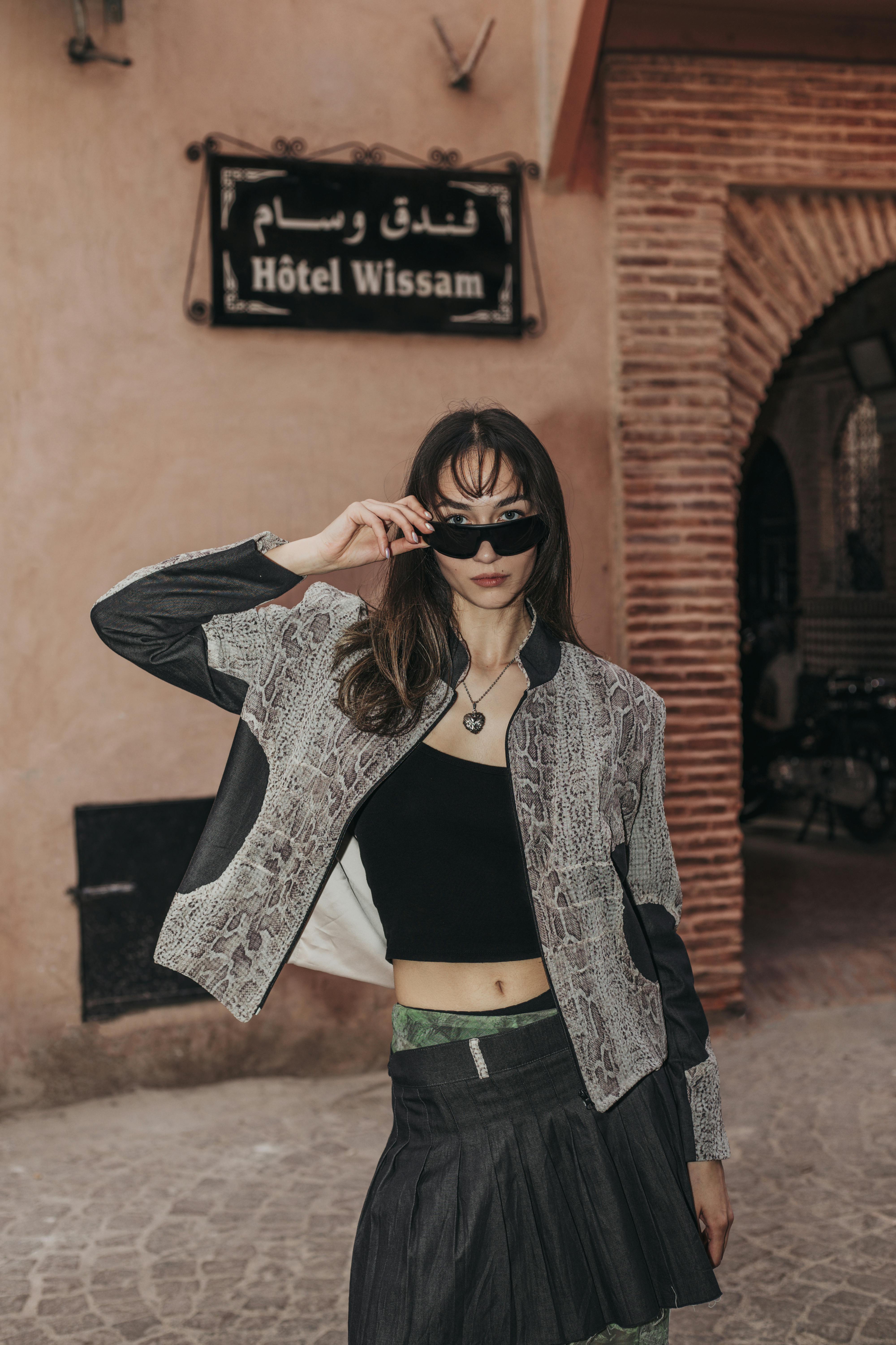 portrait of woman in jacket and sunglasses