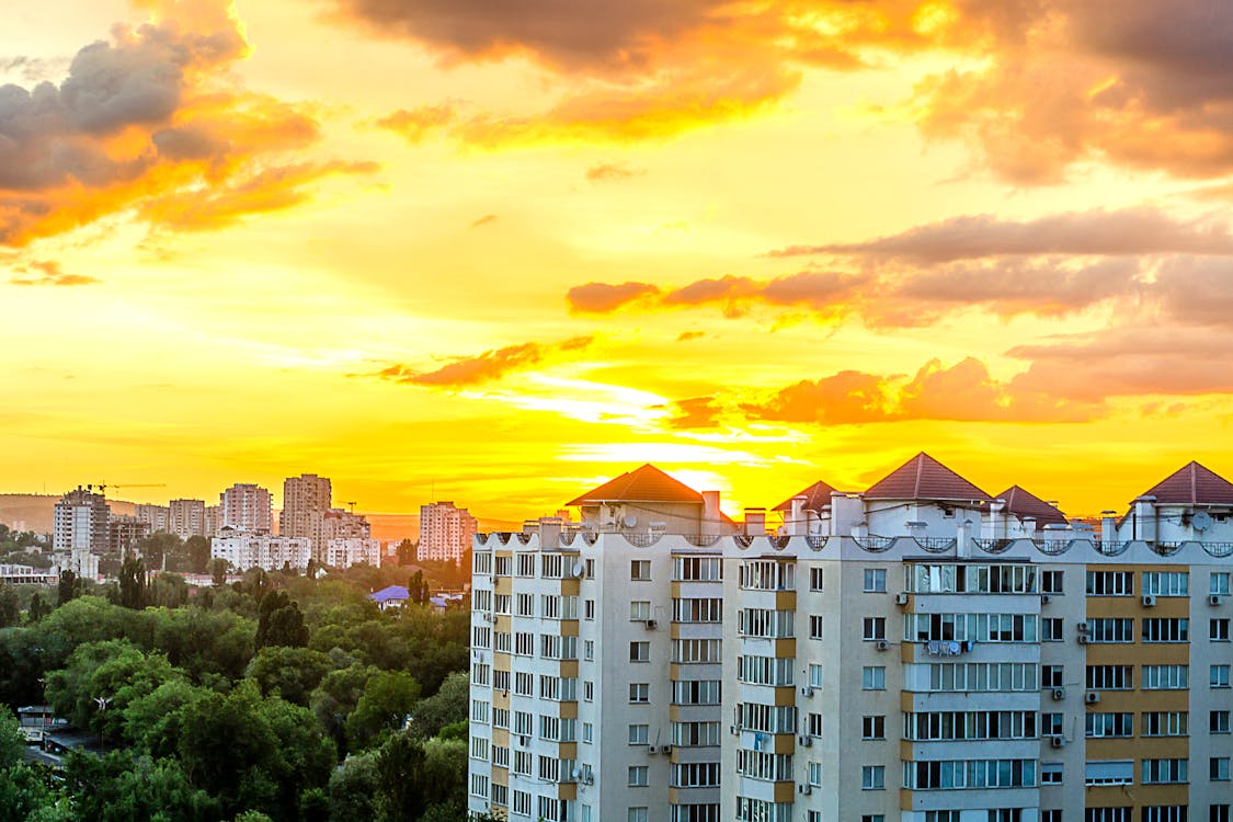 Free Gray White High Rise Building during Sun Set Stock Photo