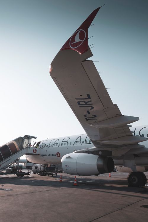 Free Turkish Airlines aircraft parked at Konya Airport with boarding stairs on a clear day. Stock Photo
