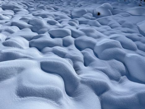 Captivating snow formations create unique patterns in a winter landscape in Sissu, India.
