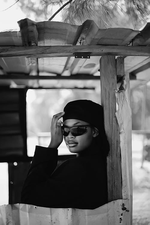 Woman in Hat and Sunglasses