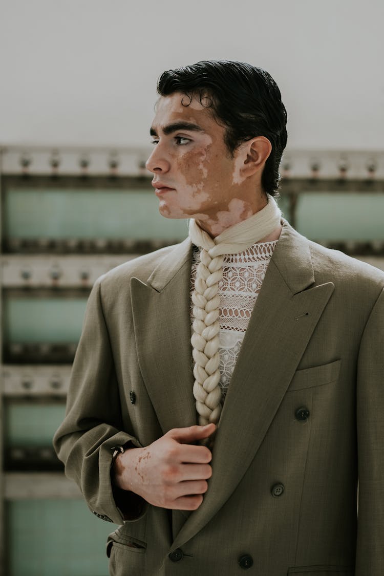 Model In An Olive Blazer And Braided Tie 