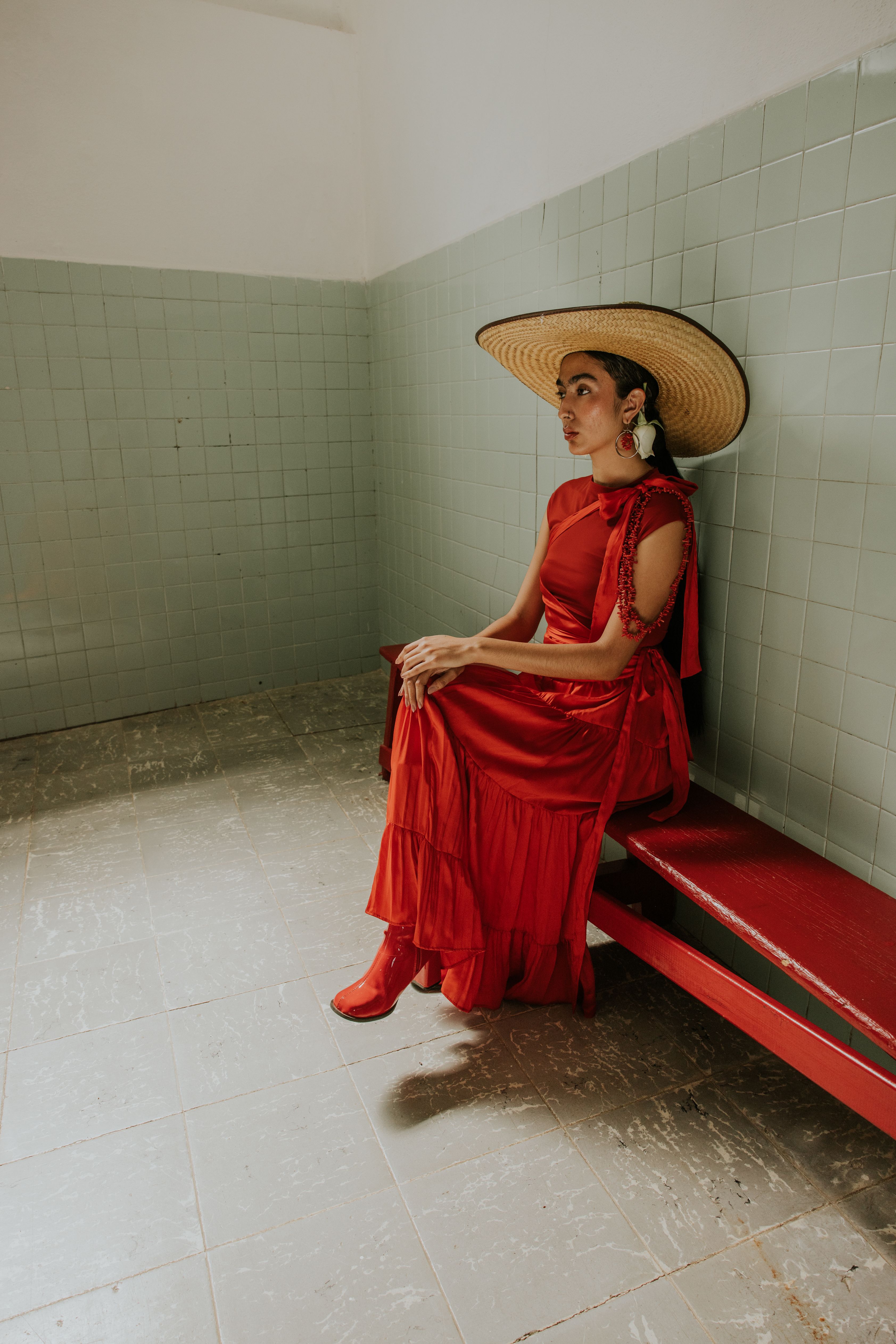 Photo of a Woman in a Red Dress and a Hat Sitting on a Bench · Free ...