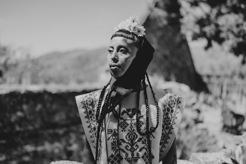 Woman in Traditional Clothing in Black and White