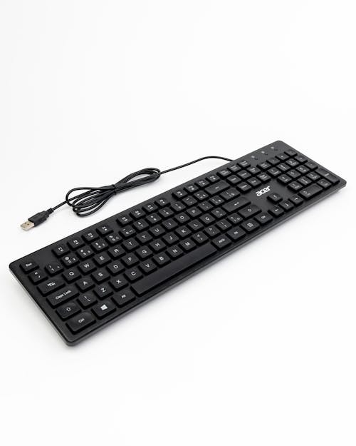 A black keyboard with a usb cable attached