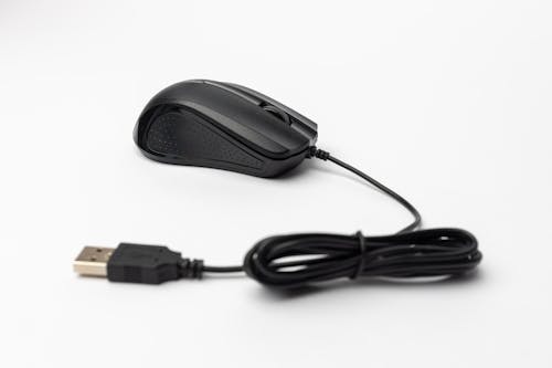 A black mouse with a cord attached to it