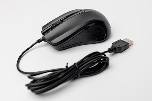 A black mouse with a cord attached to it