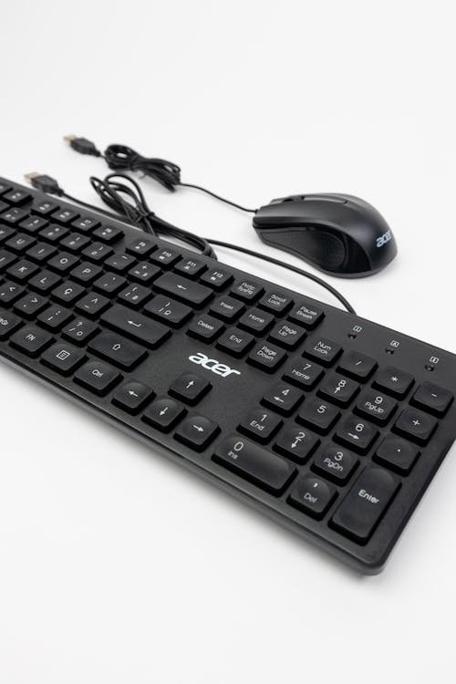 A black keyboard and mouse on a white background