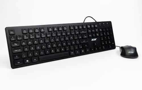 A black keyboard and mouse on a white background