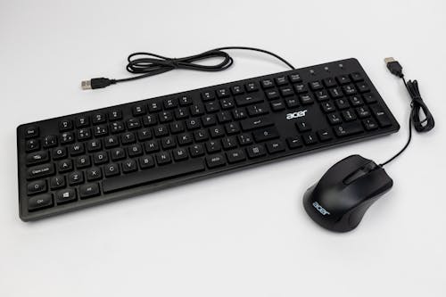 A black keyboard and mouse on a white background