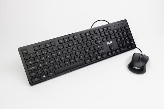 Modern black keyboard and mouse combo ideal for gaming and office environments.
