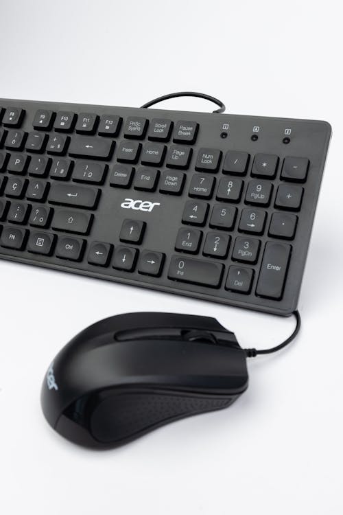 A black keyboard and mouse on a white background