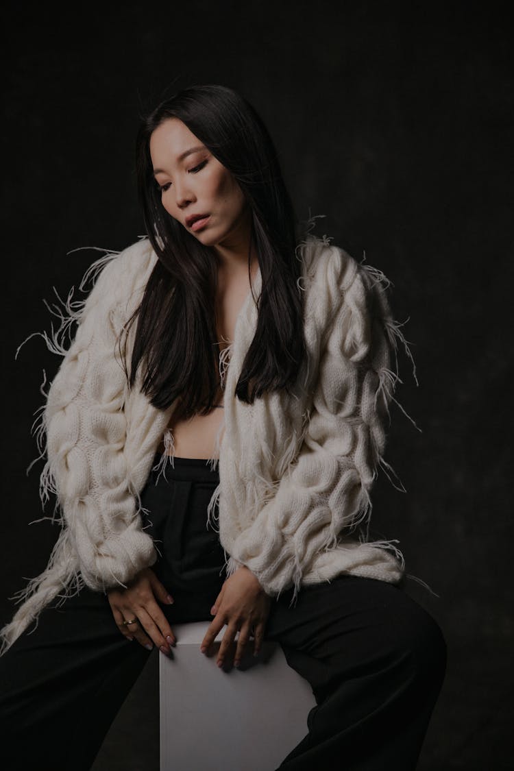 Model In White Feather Fringe Cardigan And Black Pants