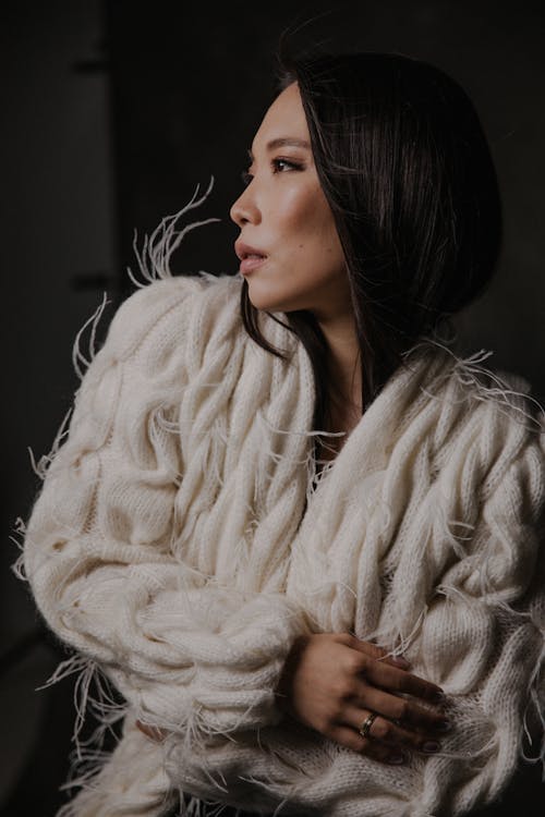 A woman in a white fluffy jacket