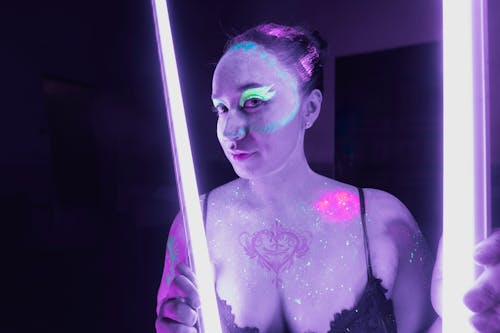 A woman with purple lights on her body
