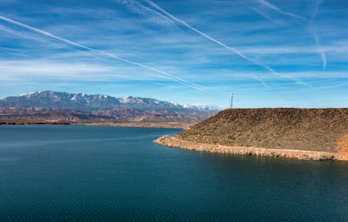 A large body of water with mountains in the background
