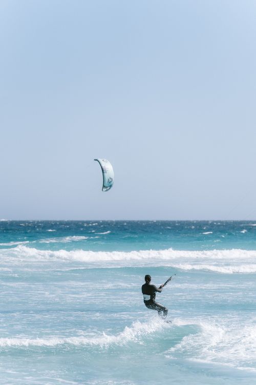 Free A thrilling kitesurfing moment captured on the waves of Esperance Beach in Western Australia. Stock Photo